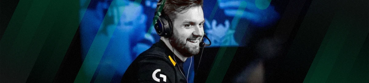 NiKo smiling while wearing a headset at an esports event
