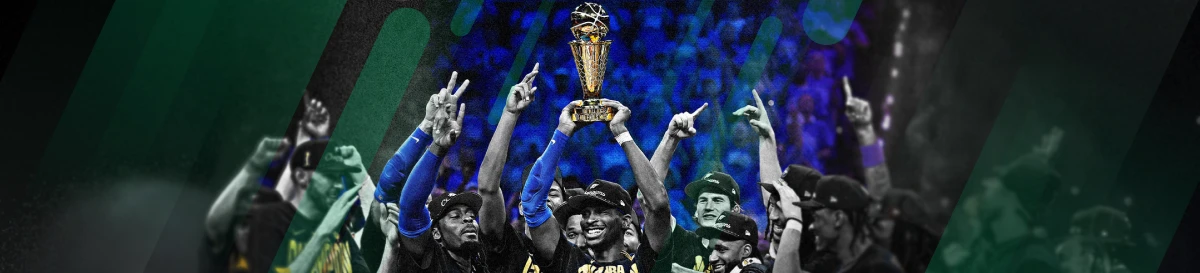 NBA players celebrating with the championship trophy held high