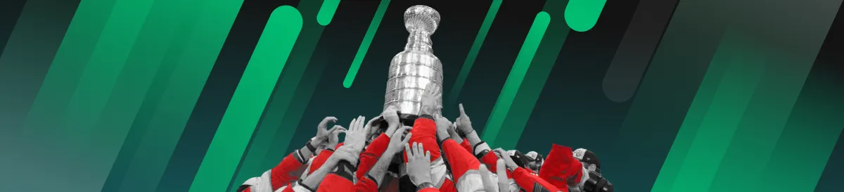 Hockey players raising the Stanley Cup trophy in celebration
